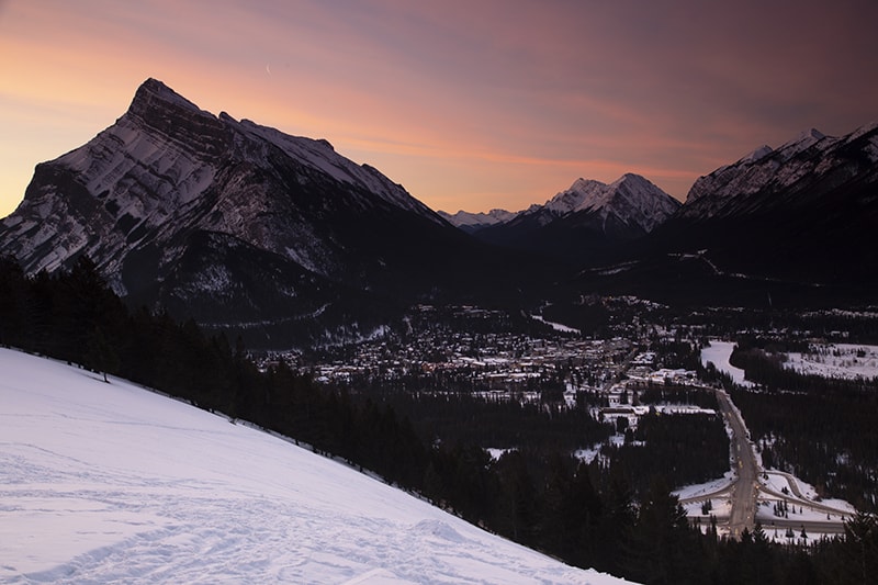 A pink sky from a sunrise over Banff, Alberta