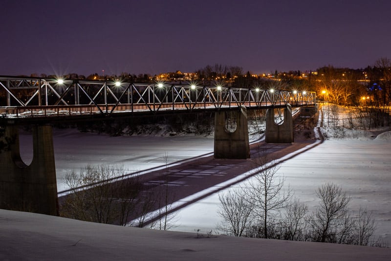 Cloverdale footbridge located in Edmonton at night in winter