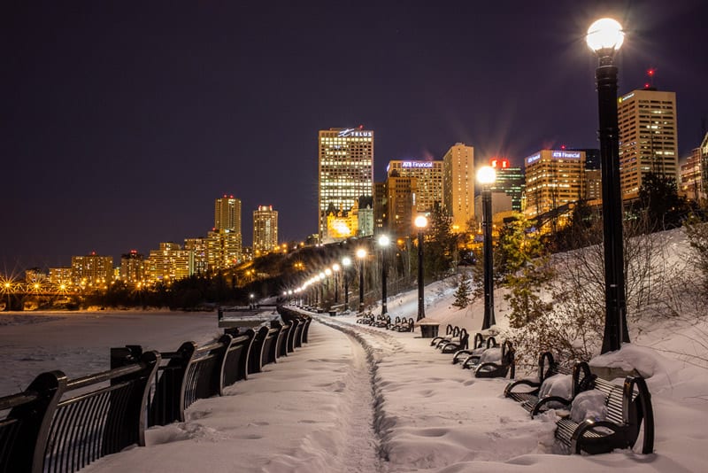 Pathway along river in downtown Edmonton at night in the winter