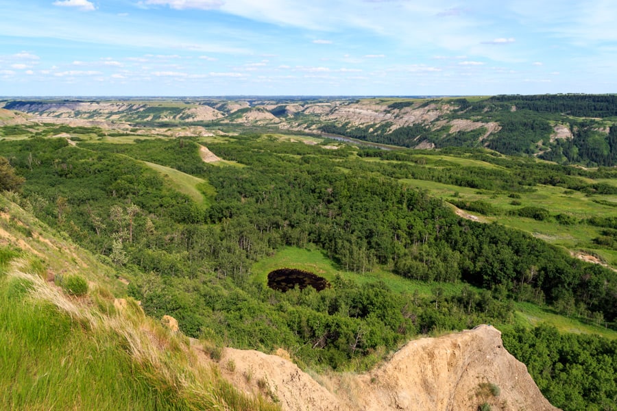 The view of Dry Island Buffalo Jumpfrom above. From here you can see the coulee, winding river, ponds and trees.