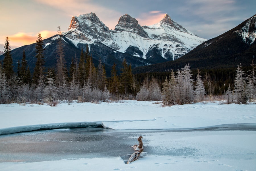 The Three Sisters mountain range in  winter at sunrise.