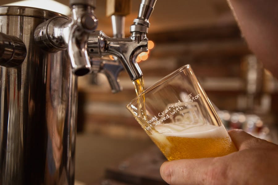 A craft beer is poured from the tap at Tool Shed Brewing in Calgary, Alberta