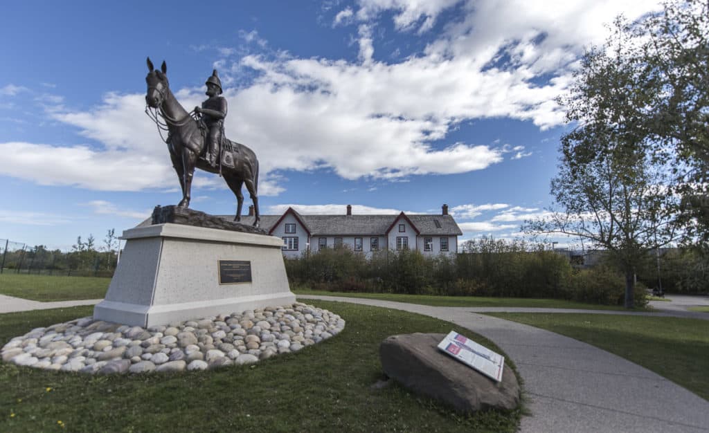 A statue in front of Fort Calgary