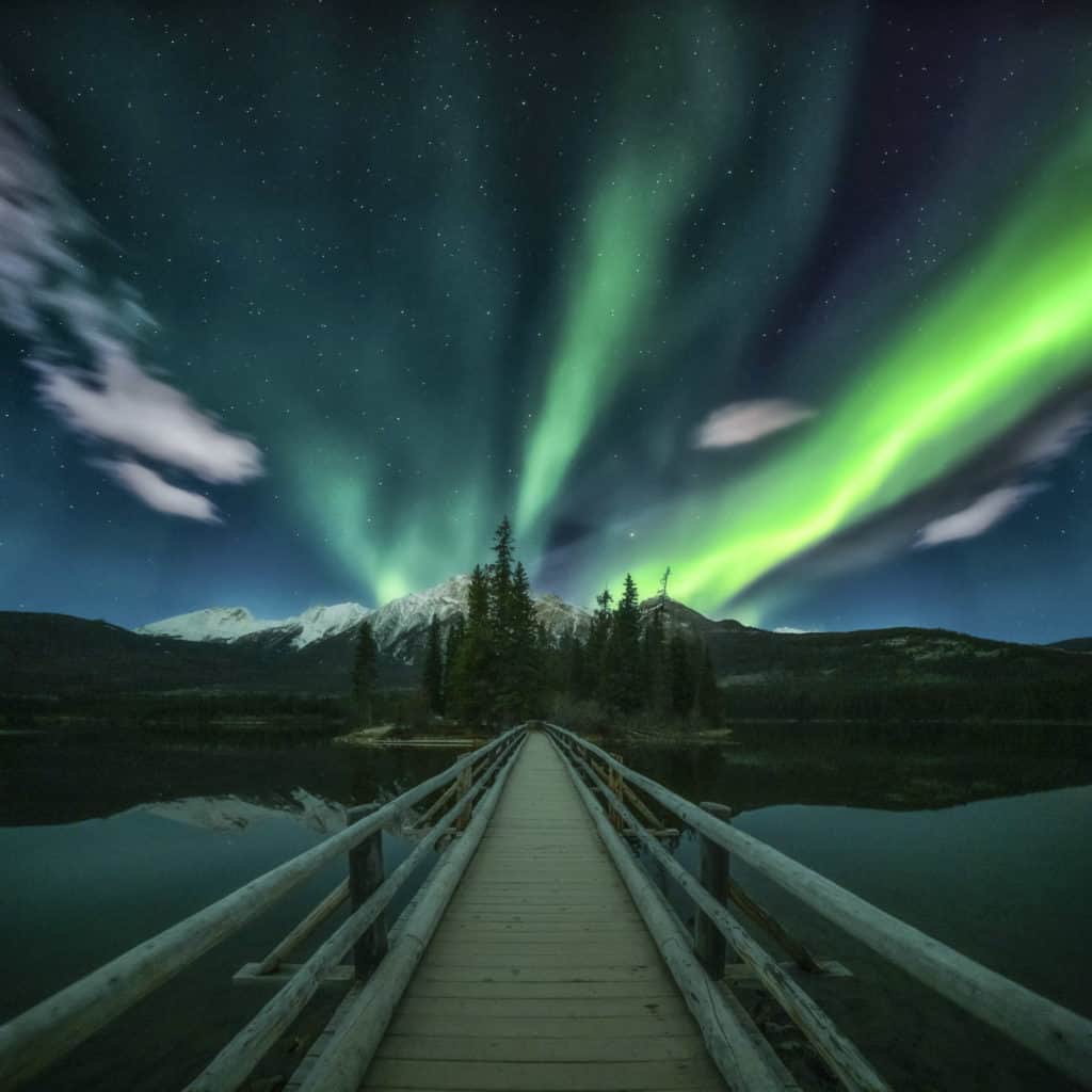 Northern Lights dance over Pyramid Lake Island in Jasper National Park