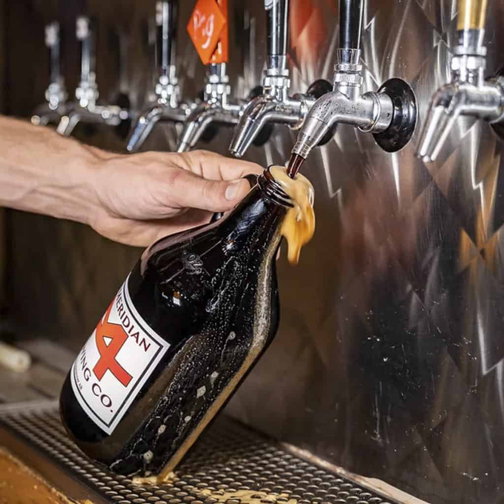 Pouring a growler at 4th Meridian Brewing