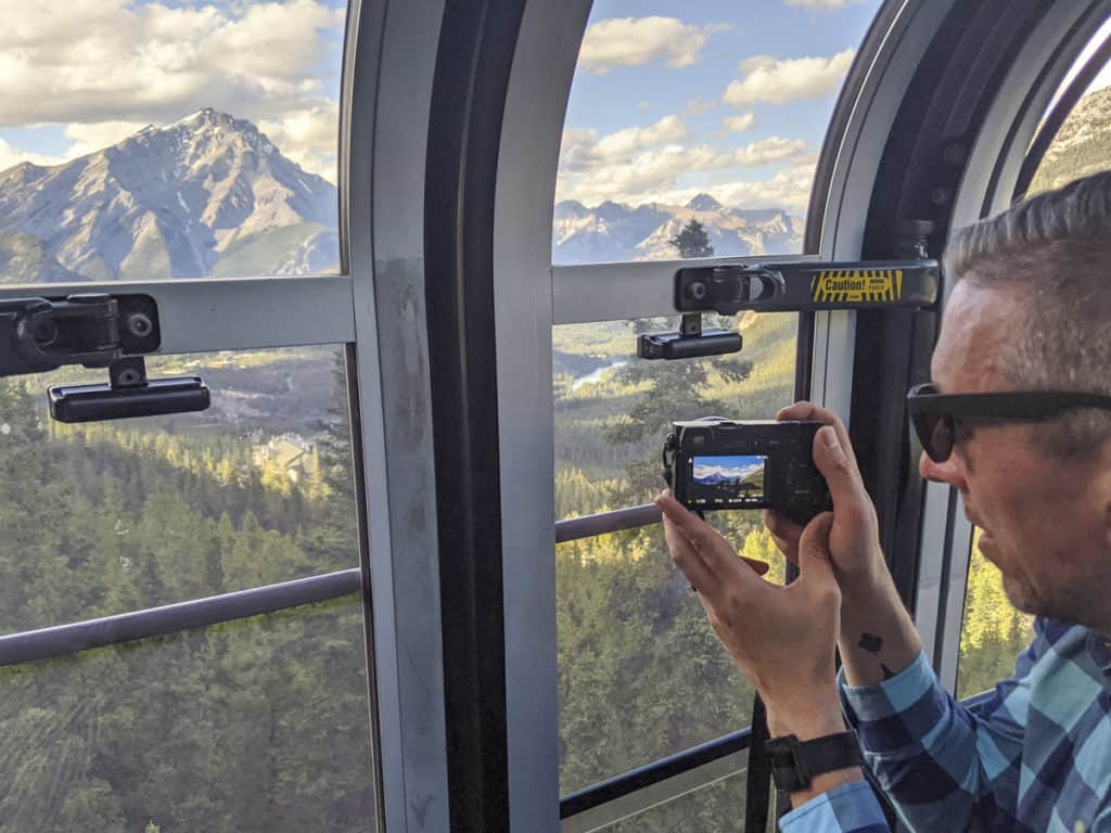 Taking photos from inside the Banff Gondola