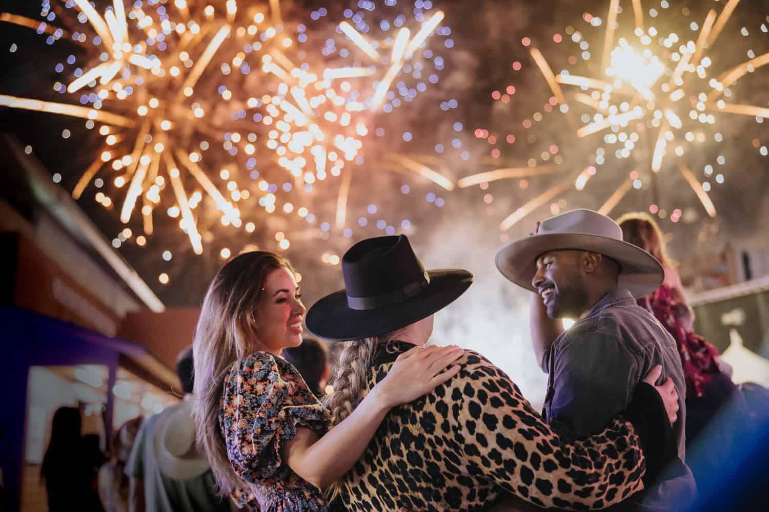 Friends take in the fireworks at the Calgary Stampede Grandstand Show.