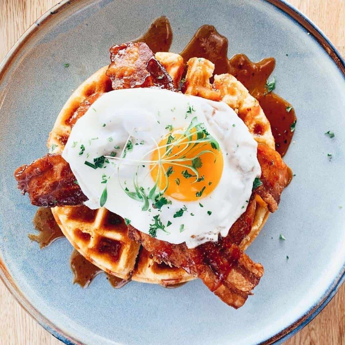 An egg and bacon topped waffle from Blue Star Diner in Calgary. 