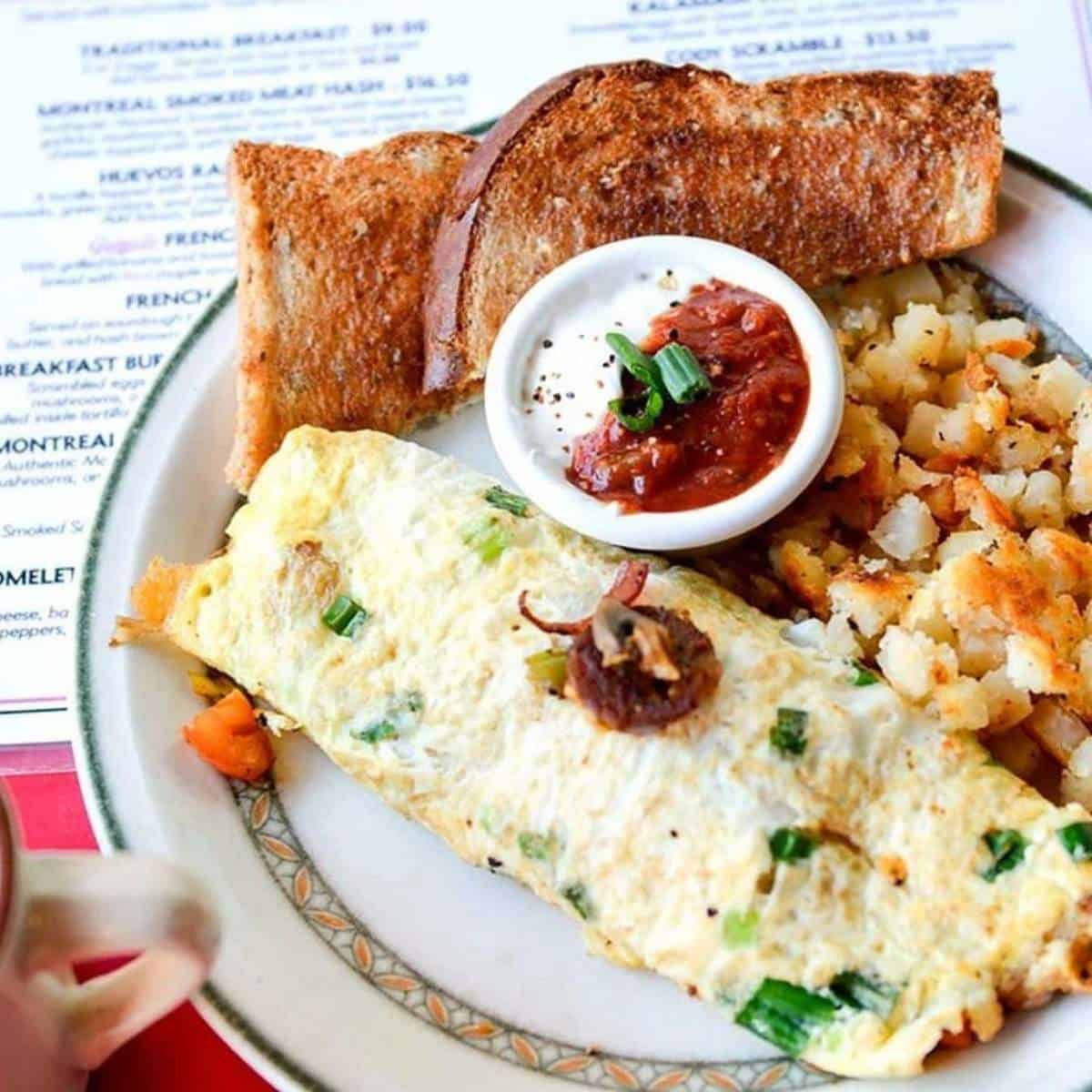 An omelette with toast and hashbrowns from Galaxie Diner in Calgary.