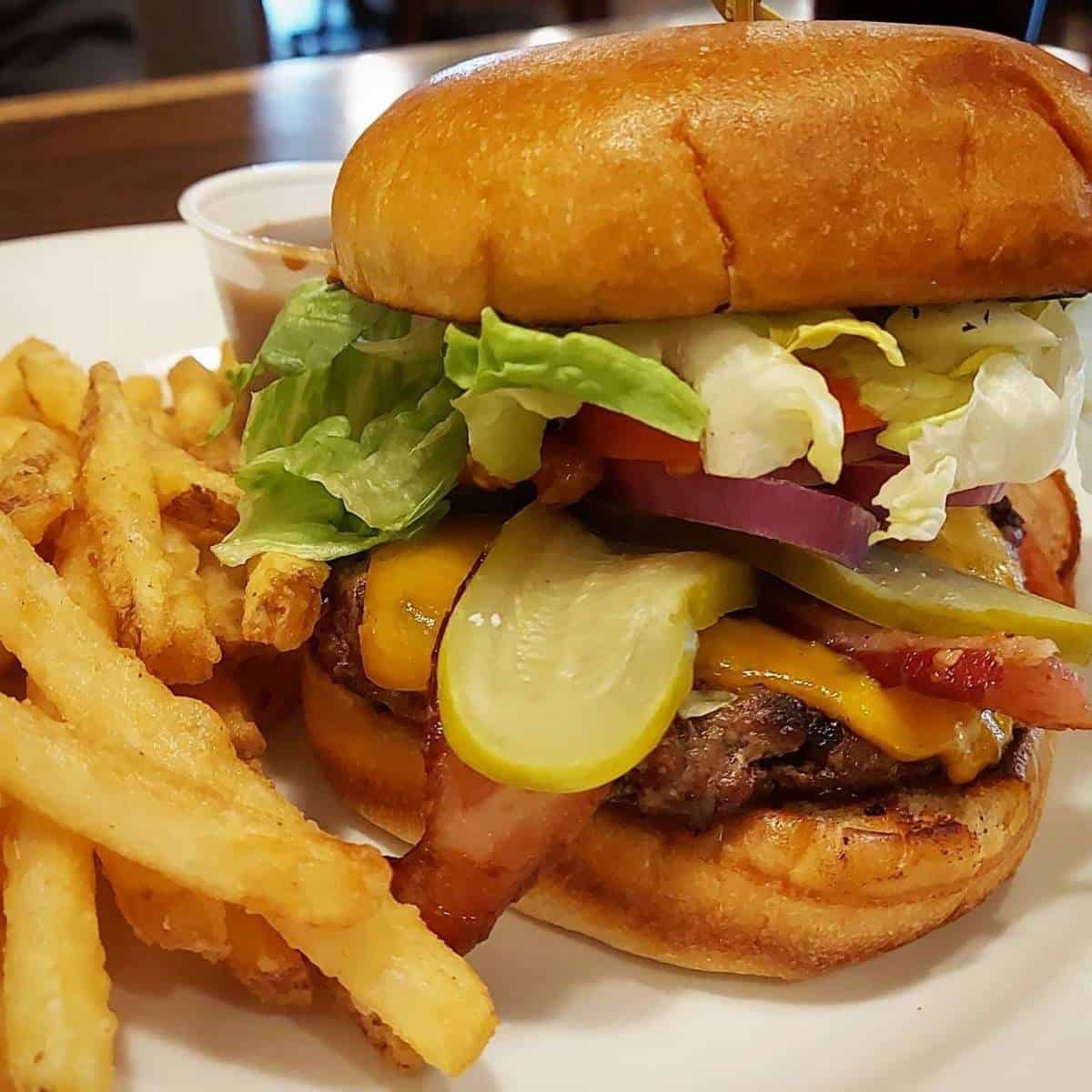 Juicy cheeseburger and fries from O'Shea's Eatery and Ale House.