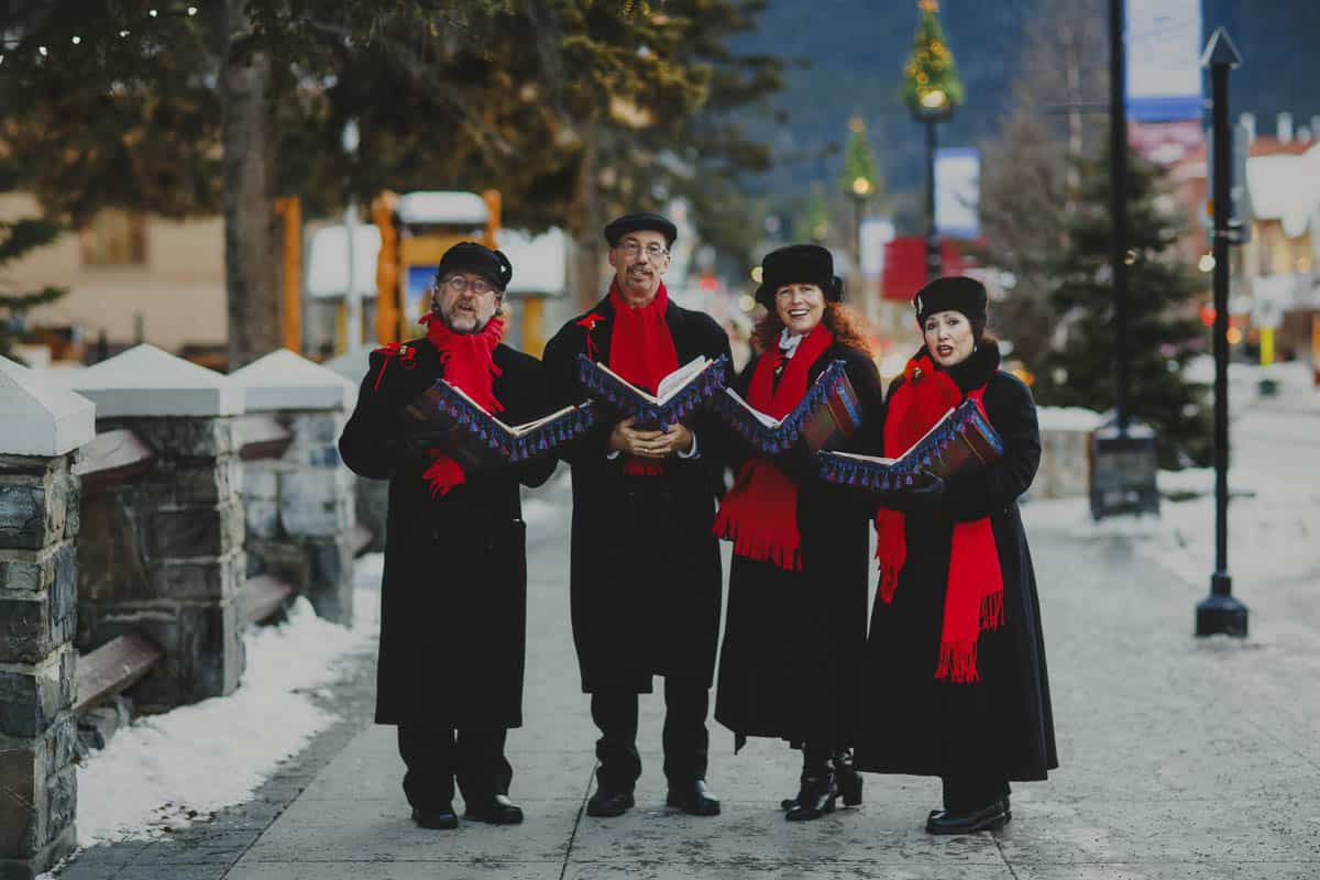 Carolers sing in Banff