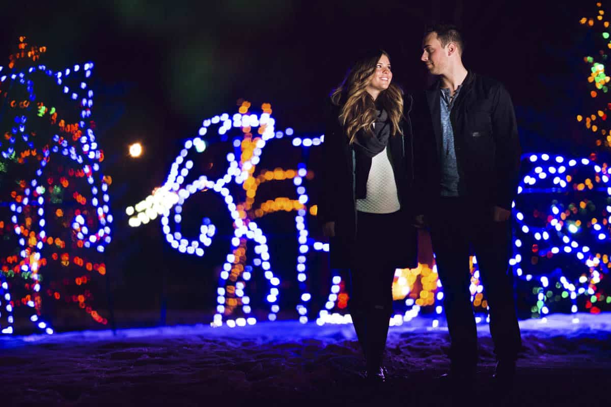 A couple walks through ZOOLIGHTS Calgary