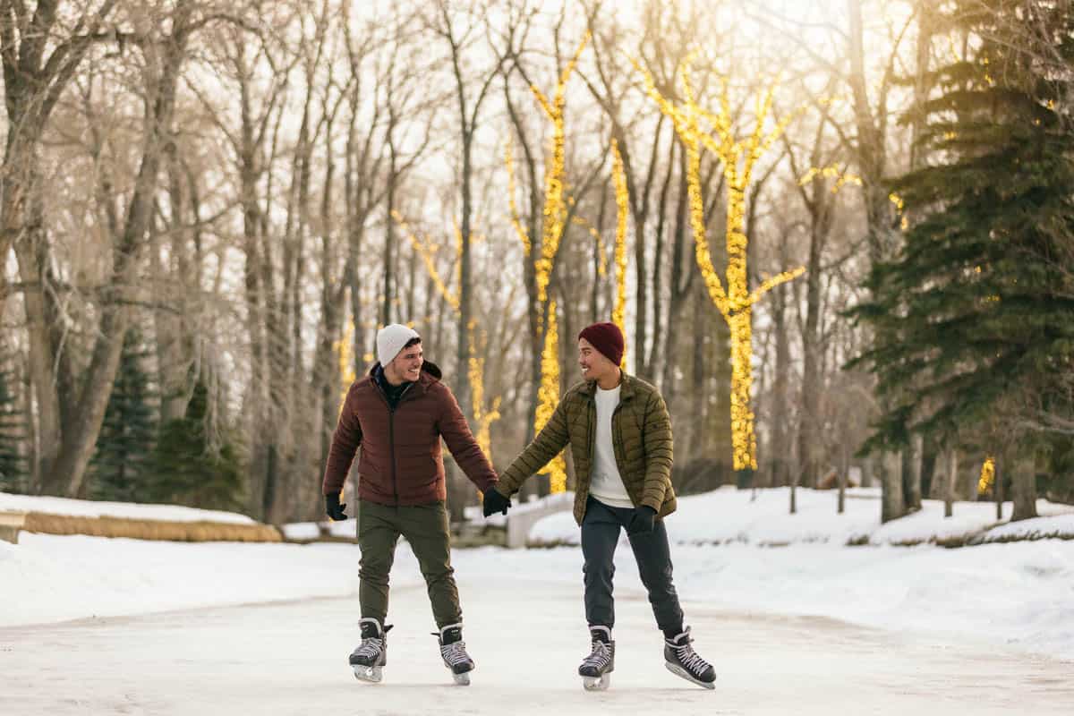 A couple ice skating in Bowness Park