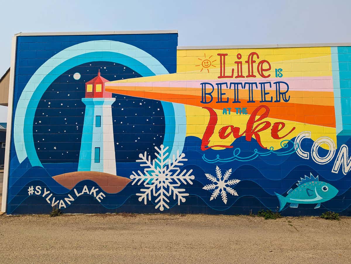 A Sylvan Lake Mural that reads Life is Better at the Lake.