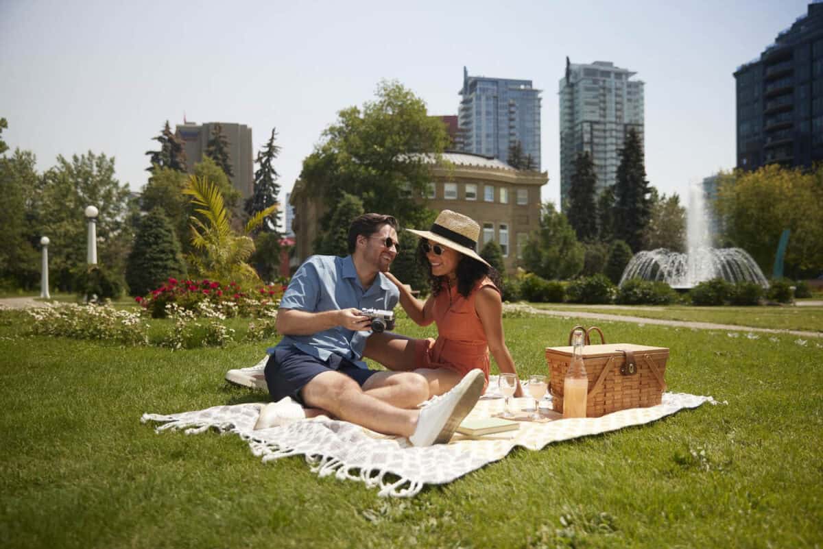 A couple has a picnic date in Calgary